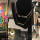 Obama by Ben Copperwheat; Mr. Big nameplate necklace; a pantsuit I die for by Jody Morlock.